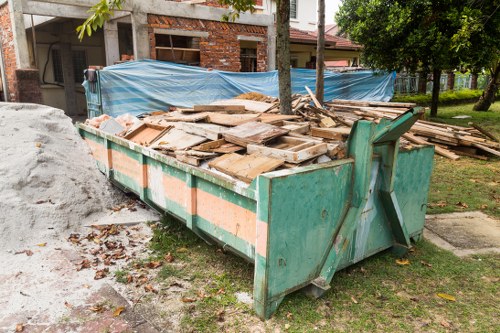 Van loading business waste outside a Feltham shop