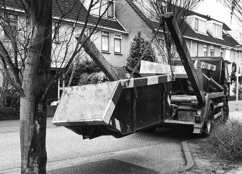 Lorry and crew leaving site after a compliant, insured commercial waste pickup